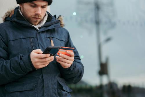 man on phone with credit card