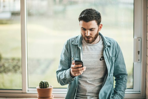 man looking at his phone