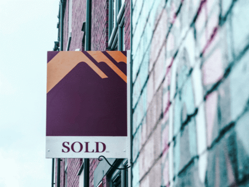 sold sign to show costs of buying and selling