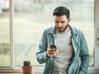 man looking at his phone 